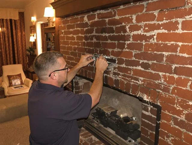 Lakeland Chimney Sweep expert fixing a fireplace in Lakeland, FL